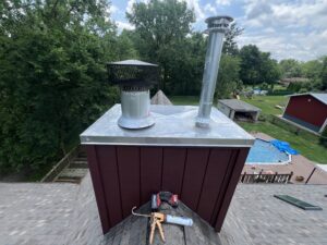 Chimney chase top with rain cover and siding - chimney structure inspection in Chicagoland