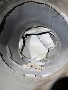 Crushed chimney flue causing dangerous blockage and carbon monoxide risk - chimney inspection in Chicago, IL