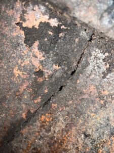 Level 2 chimney inspection revealing vertical crack in chimney lining - fire damage inspection in Chicago, IL