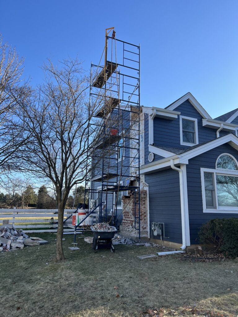 Chimney removal and rebuild after fire - custom new construction masonry and prefab install in Chicago suburbs