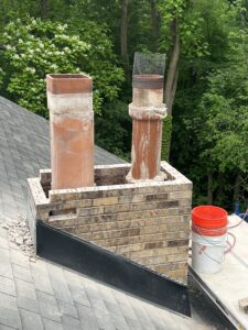 Chimney rebuild in progress - brick masonry restoration by Midwest Chimney Specialists, Chicagoland