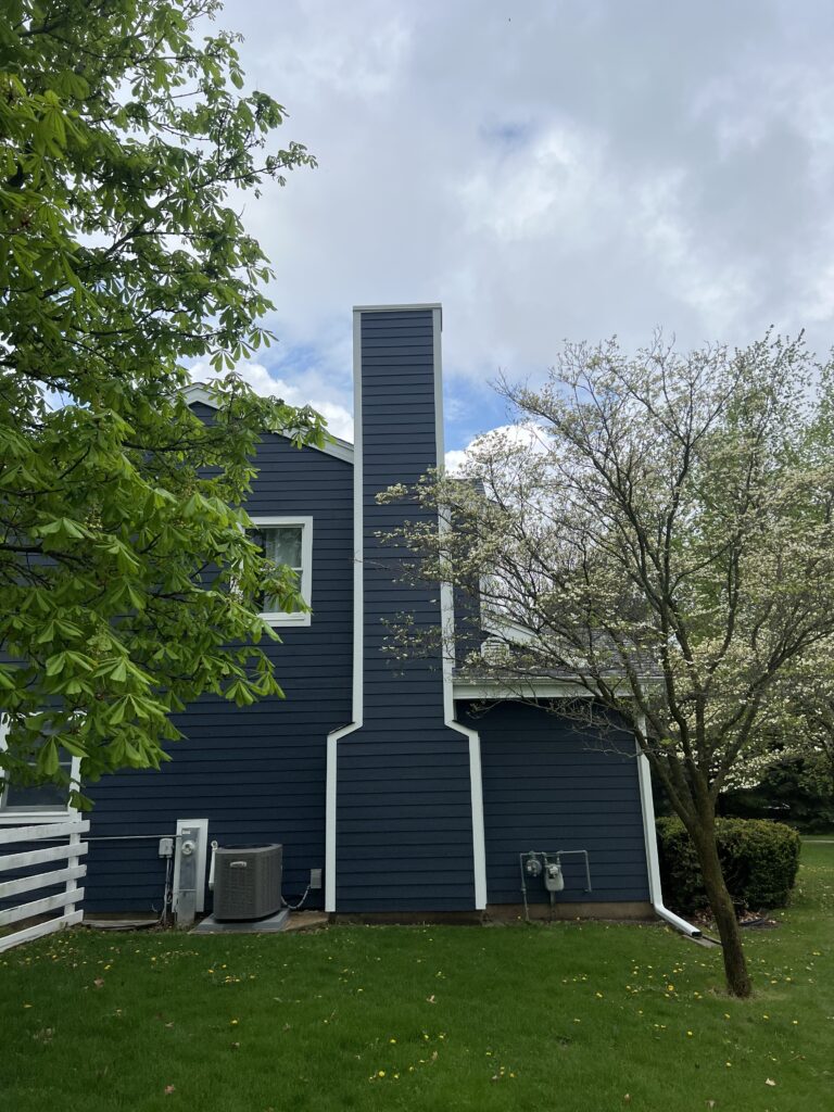 Chimney rebuild and siding repair completed after chimney fire - restoration in Chicagoland