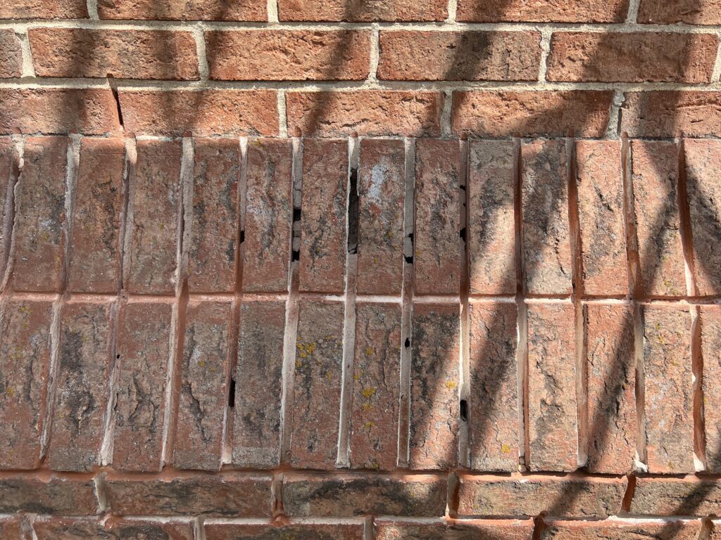 Chimney tuckpointing in progress - mortar joint repair and masonry restoration in Chicago, IL