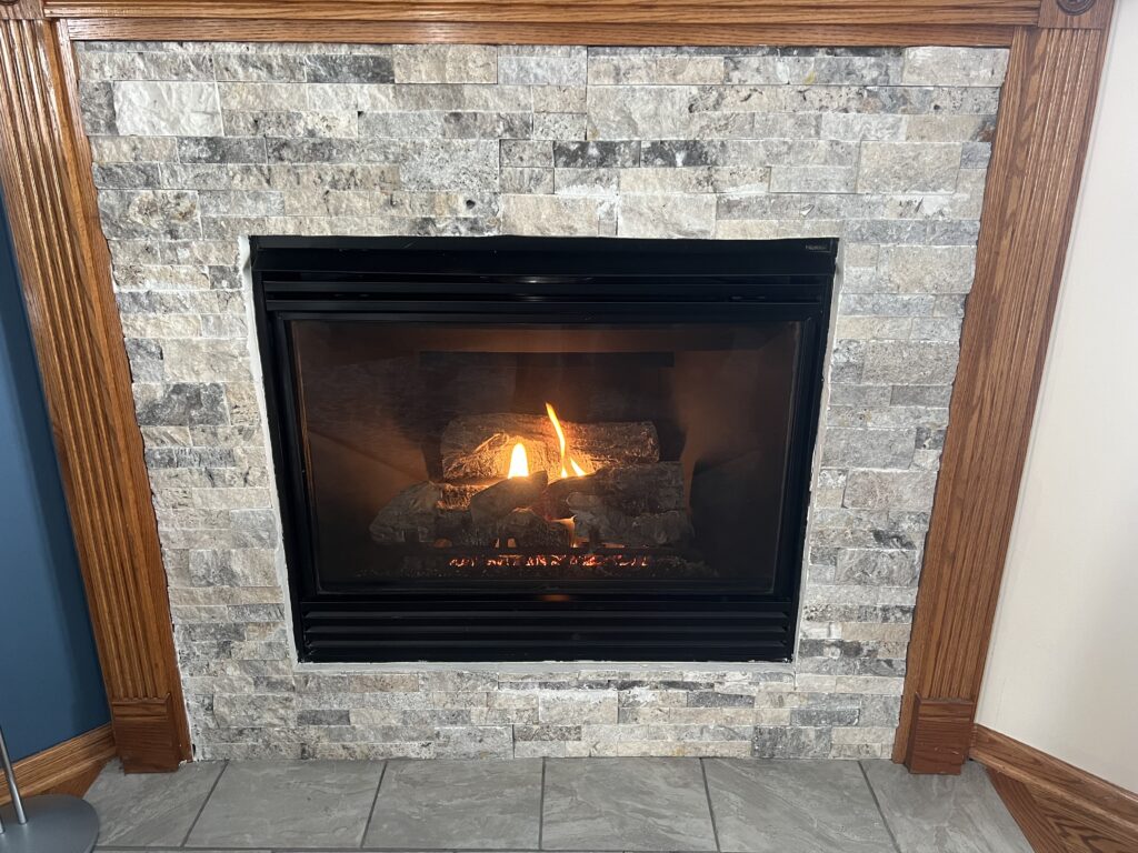 Direct vent gas log after tune-up and service - gas fireplace maintenance by Midwest Chimney Specialists