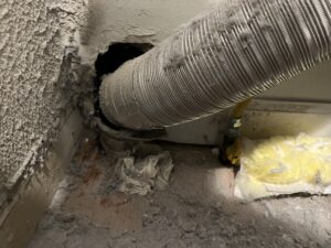 Professional dryer vent cleaning in progress - lint blockage removal and airflow restoration in Chicago suburbs
