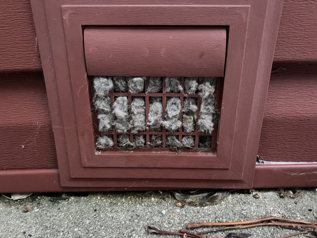 Dryer vent blockage and fire hazard restriction cleared - professional dryer vent cleaning in Chicagoland