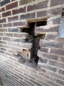 Brick replacement with access holes for new furnace liner install - masonry and liner work by Midwest Chimney Specialists