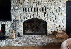 Custom glass doors on masonry wood-burning fireplace - fireplace door installation by Midwest Chimney Specialists