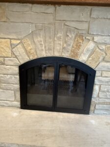 Custom wood-burning masonry fireplace with glass door installation - fireplace upgrade by Midwest Chimney Specialists