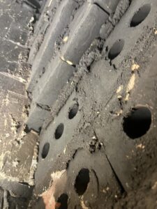 Smoke chamber latent defect with exposed holes - Chamber-Safe sealant application during chimney inspection in Chicagoland