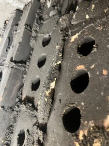 Exposed chimney block cores in smoke chamber creating fire hazard - safety inspection and sealant repair in Chicago, IL