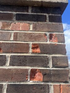 Spalled and failed brick chimney requiring replacement - masonry repair and brick replacement in Chicago, IL