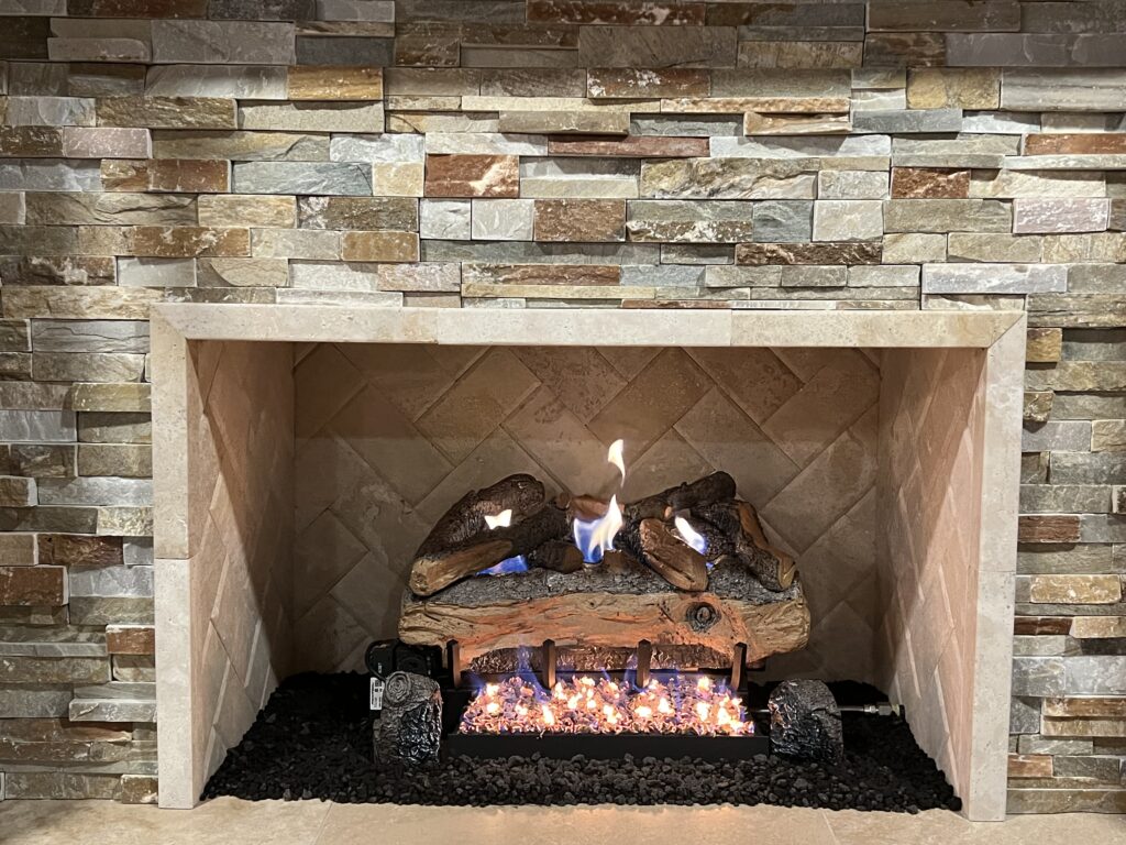 Vent-free fireplace with remote control and custom tile veneer surround - ventless fireplace install in Chicago suburbs