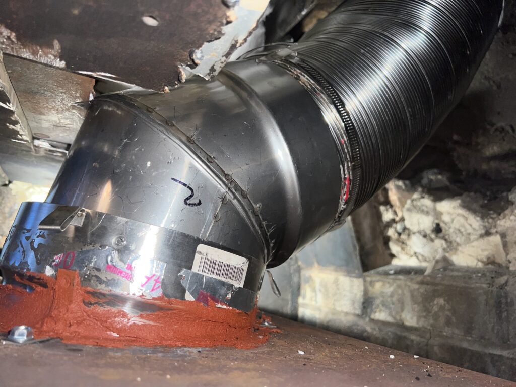 Wood stove chimney liner installation - stainless steel liner relining by Midwest Chimney Specialists in Chicagoland