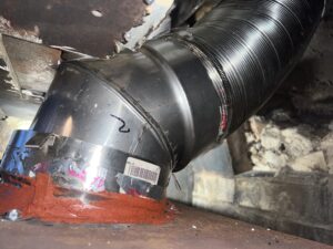 Wood stove chimney liner installation - stainless steel liner relining by Midwest Chimney Specialists in Chicagoland